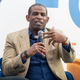 Deion Sanders speaks on stage during the 2022 International Poverty Forum at Porsche Cars North America on March 04, 2022 in Atlanta, Georgia.